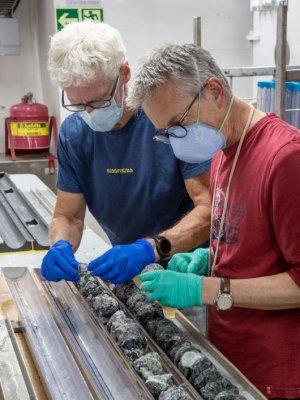Professor Southam (left) examining the mantle rock samples. Image: Lesley Anderson